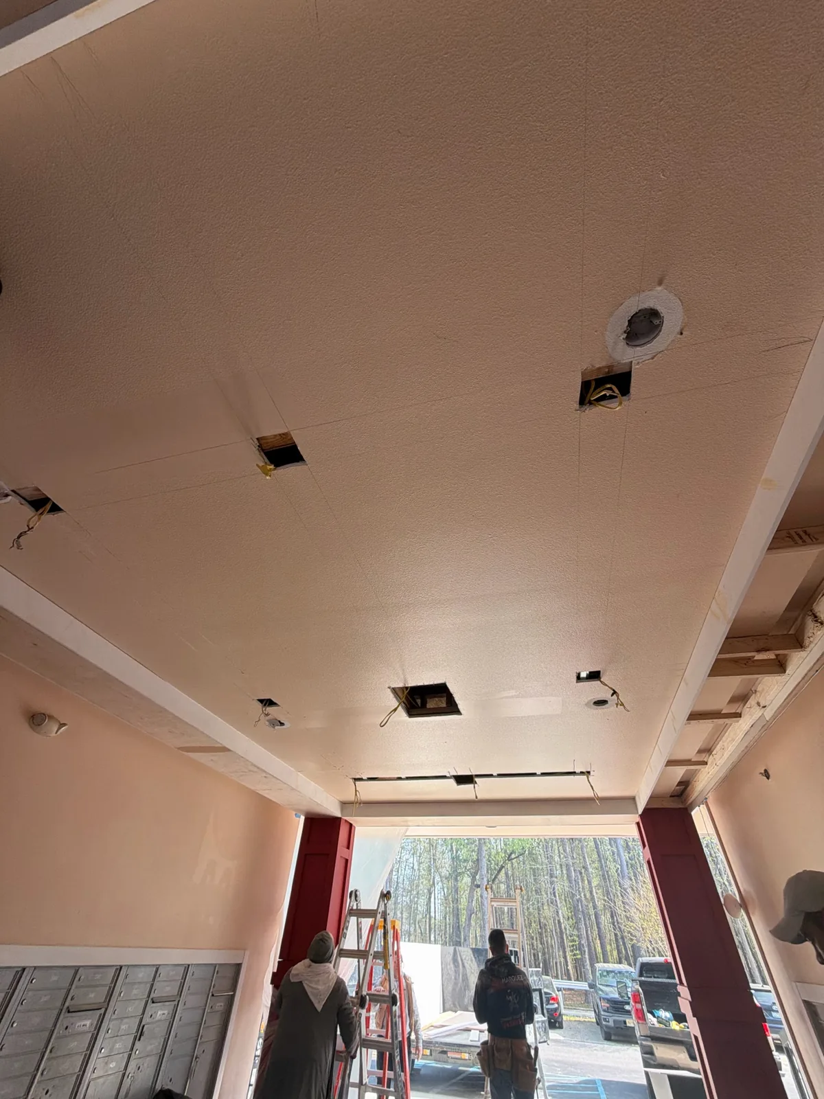 Apartment ceiling preparation work with openings for fixtures
