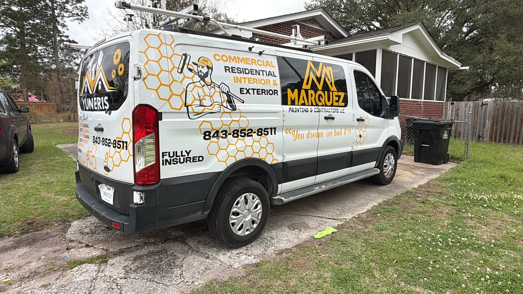 Marquez Painting branded work van parked at a residential project site
